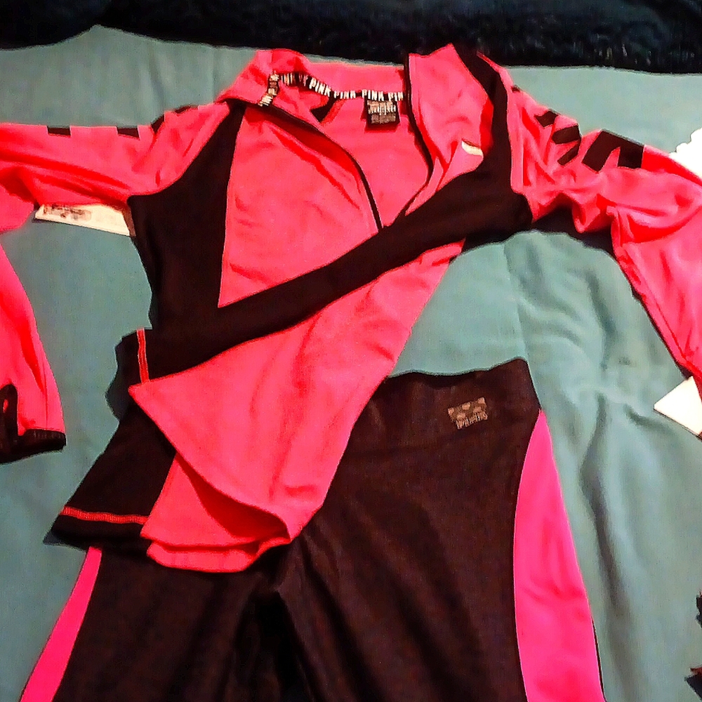 Pink warm up suit, the bottom is a small, the top is med